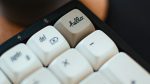 Close up of a monochrome keyboard with one key in focus - "hello"